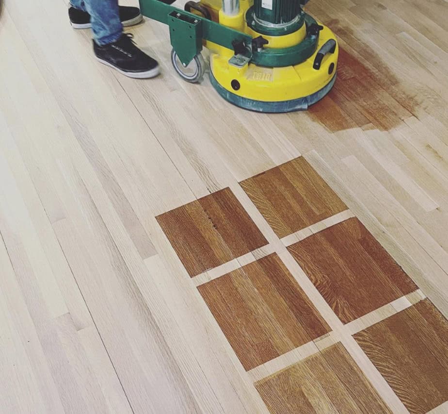 A grid of wood stain color tests and a worker with a dustless sander.